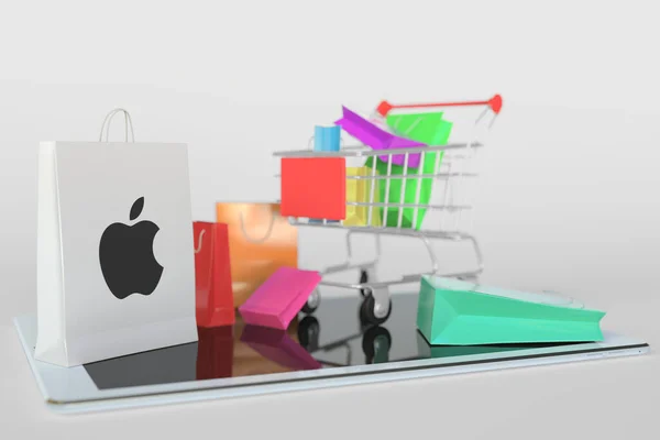 Nákupní košík na tabletu a papírový sáček s logem Apple Inc. Editorial e-commerce related 3D rendering — Stock fotografie