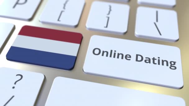 Текст онлайн-датування та прапор Нідерландів на клавішних. Концептуальна 3D-анімація — стокове відео