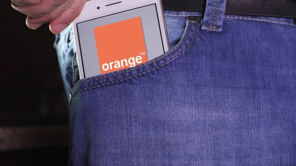 Smartphone with Orange SA logo on the screen. Editorial shot — Stock Photo, Image