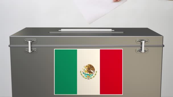 Hand putting paper ballot into ballot box with flag of Mexico. Election related clip — Stock Video