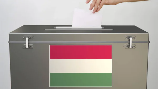 Putting paper ballot into ballot box with flag of Hungary. Voting related 3d rendering — Stock Photo, Image