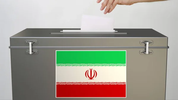Прапор Ірану на виборчій скриньці і вручну класти паперовий бюлетень, 3d рендеринг — стокове фото