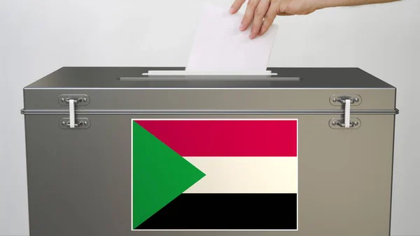 Bandiera del Sudan su scheda elettorale e mano mettendo scheda elettorale, rendering 3d — Foto Stock