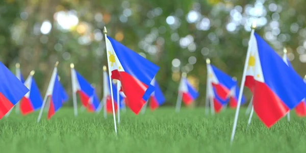 Flagi Filipin w trawie. Święto narodowe związane z renderowaniem 3D — Zdjęcie stockowe