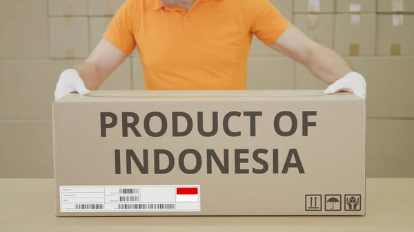 PRODUCT OF INDONESIA printed text on the side of a big cardboard box in a warehouse — Stock Photo, Image