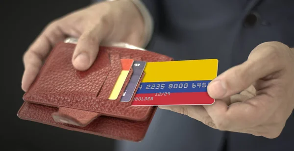 Άντρας βγάζει πλαστική τραπεζική κάρτα με σημαία της Κολομβίας από το πορτοφόλι του, αριθμός πλασματικής κάρτας — Φωτογραφία Αρχείου