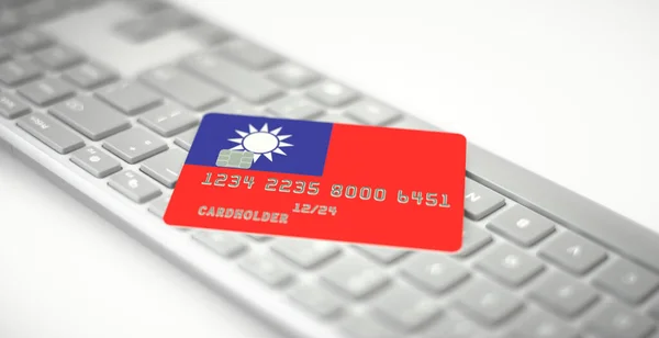 Plástico cartão bancário retratando bandeira de Taiwan no teclado do computador. Números fictícios — Fotografia de Stock