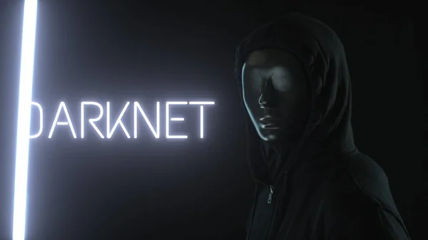 Muž s černou maskou a světlem odhalujícím DARKNET slovo — Stock fotografie