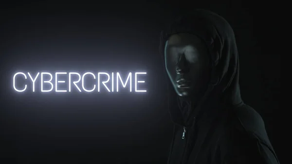 Uomo con la maschera nera e la parola CYBERCRIME accesa — Foto Stock