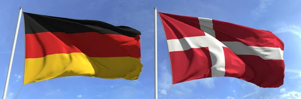 高旗竿にドイツとデンマークの旗を掲揚。3Dレンダリング — ストック写真