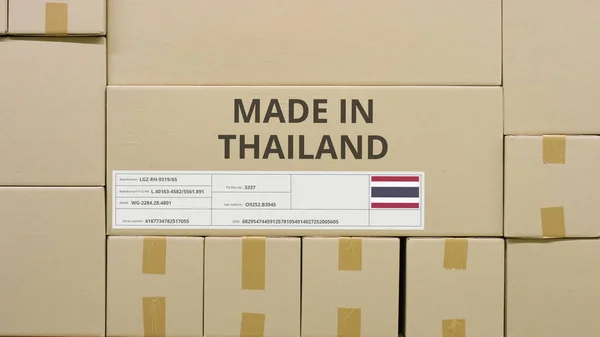 Carton with printed MADE IN THAILAND text and flag. Warehouse logistics concept — Stock Photo, Image