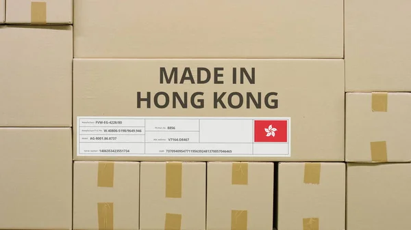 Cartón con texto impreso MADE IN HONG KONG y bandera. Concepto logístico almacén —  Fotos de Stock