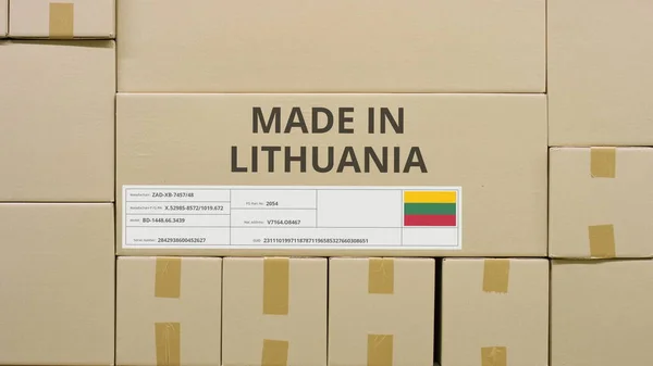 Cardboard box with printed MADE IN LITHUANIA text among other boxes — Stock Photo, Image