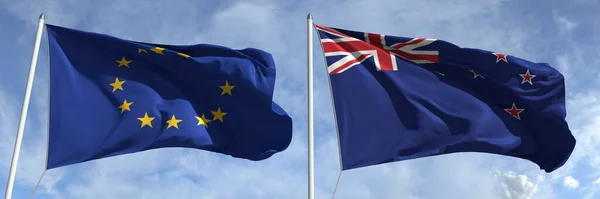 Flaggen der Europäischen Union und Neuseelands an Fahnenmasten. 3D-Darstellung — Stockfoto