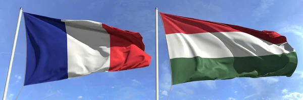 Ondeando banderas de Francia y Hungría en los asta de la bandera, 3d renderizado — Foto de Stock