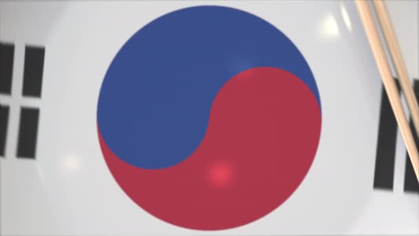 Palillos y placa con bandera impresa de Corea del Sur, concepto de cocina nacional — Vídeo de stock