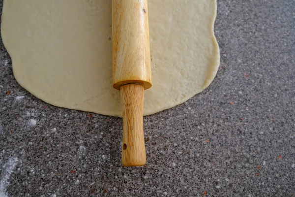 Rolling pin with dough to prepare Nigerian Chin Chin — Stock Photo, Image
