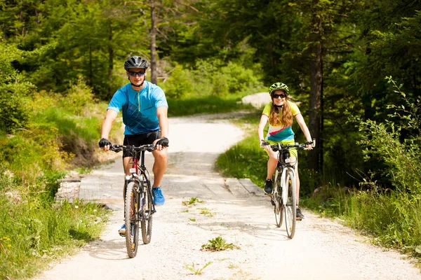 Active Young Couple Biking Forest Road Mountain Spring Day — Stock Photo, Image