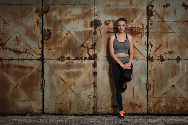 Beautiful Young Sporty Woman Listen Music Relax Rusty Industrial Door — Stock Photo, Image