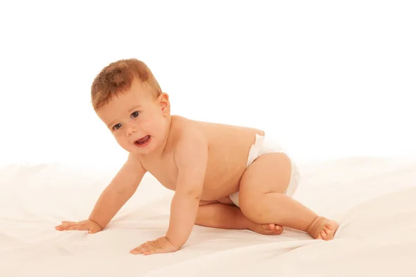 Hapy Bebê Menino Jogar Cama Isolado Sobre Branco — Fotografia de Stock