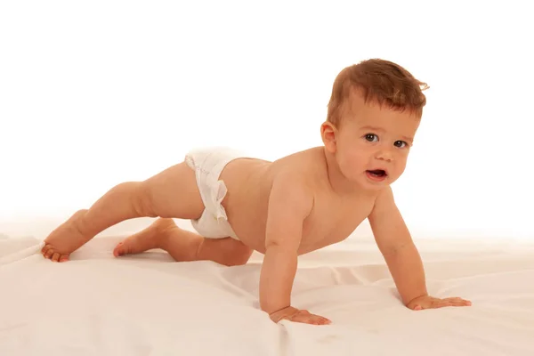 Hapy Bebê Menino Jogar Cama Isolado Sobre Branco — Fotografia de Stock