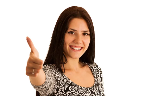 Привлекательная молодая женщина жестикулирует успехи показывая большой палец вверх изолировать — стоковое фото