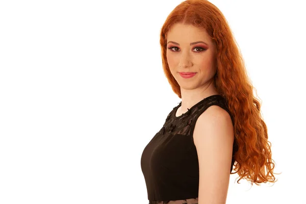 Beauty portrait of a preety redhead in black elegant dress over — ストック写真