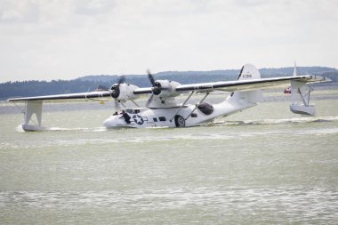 GIZYCKO, POLAND - AUGUST 5, 2018: Flight Boat Consolidated PBY Catalina at Air Show Mazury 2018 event at the lake Niegocin in Gizycko. Poland. clipart
