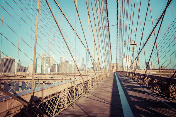 Brooklyn Bridge in New York City. Famous landmark in USA at morning light.
