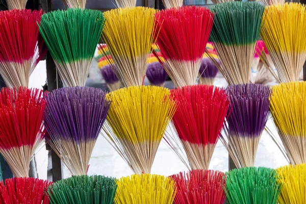 Large display of colorful Incense sticks on sale at a Vietnam village near Hue