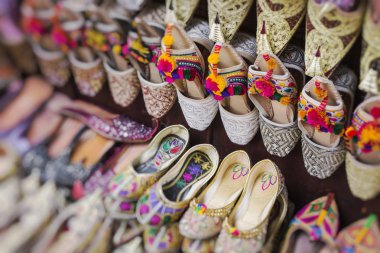 Shoes in arabian style, market of Dubai. Selective Focus. clipart