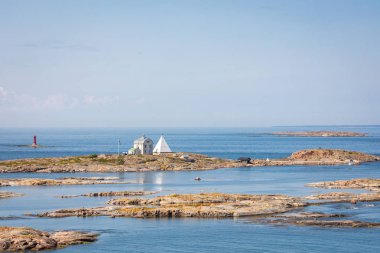 Kobba Klintar, an old pilot station in Aland archipelago with ca clipart