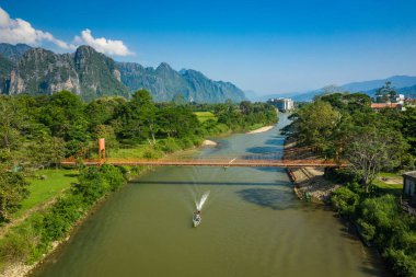 Aerial view of village Vang Vieng and  Nam Song river , Laos. So clipart