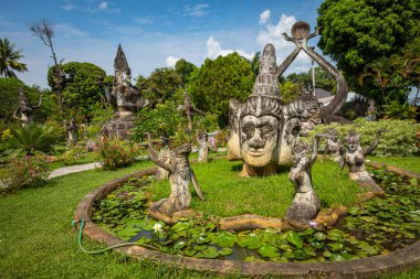 Buddha park Xieng Khouane in Vientiane, Laos. Famous travel tour clipart