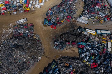 Scrapyard Aerial View. Old rusty corroded cars in car junkyard. Car recycling industry from above.  clipart