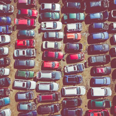 Scrapyard Aerial View. Old rusty corroded cars in car junkyard. Car recycling industry from above.  clipart