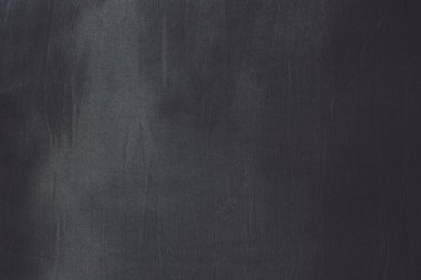 Kapalı gri renkli kumaş dokusu doğal ışık arkaplanı.