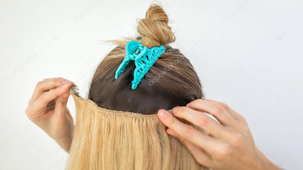 Extension of natural hair with hairpins and clips