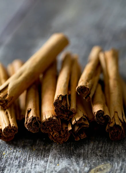 ceylon cinnamon sticks on wooden surface