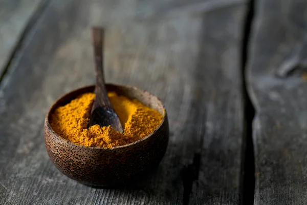 curry powder on wooden surface