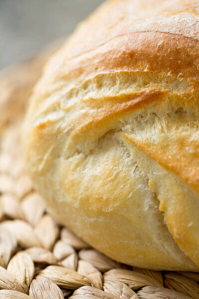 Appetizing aromatic bread on wooden surface