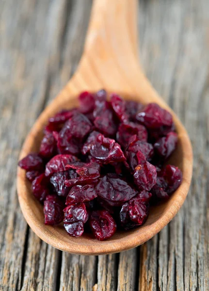 cranberry on wooden surface