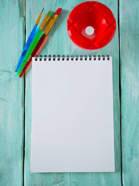 Colorful Paintbrushes Notebook Wooden Surface — Stock Photo, Image