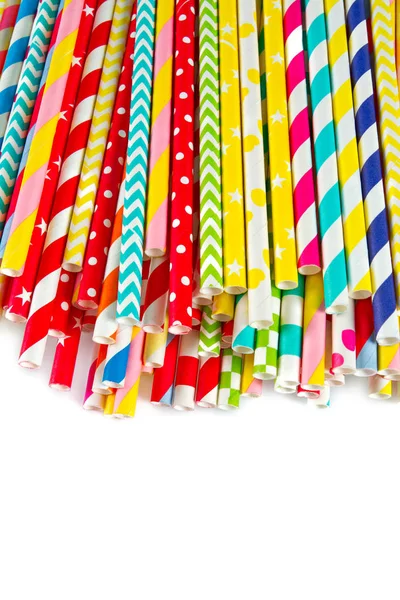 multicolored paper straws on white background