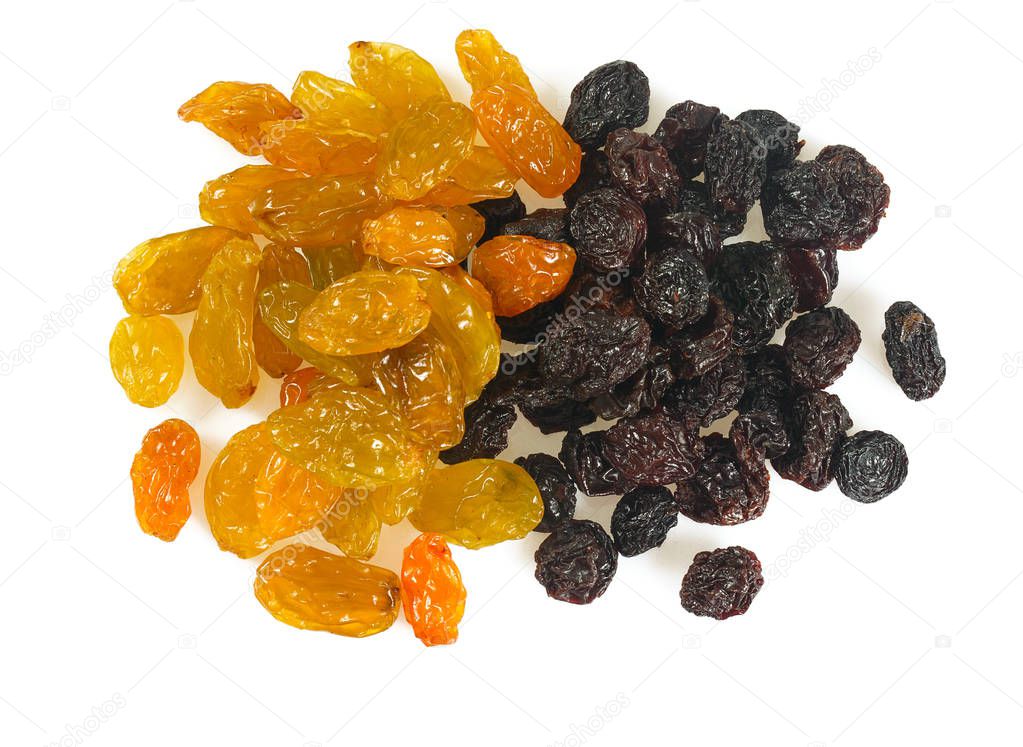 close-up view of black and yellow raisins isolated on white background