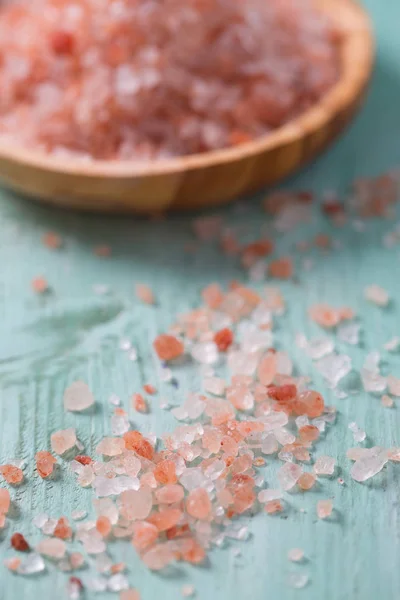 Himalayan Salt on turquoise wooden surface