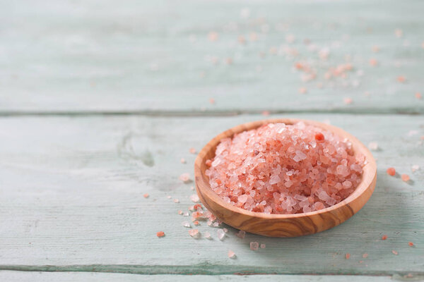 Himalayan Salt on turquoise wooden surface