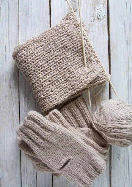 Grey Knitting Wooden Surface — Stock Photo, Image