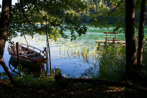 an old wooden boat on a lake