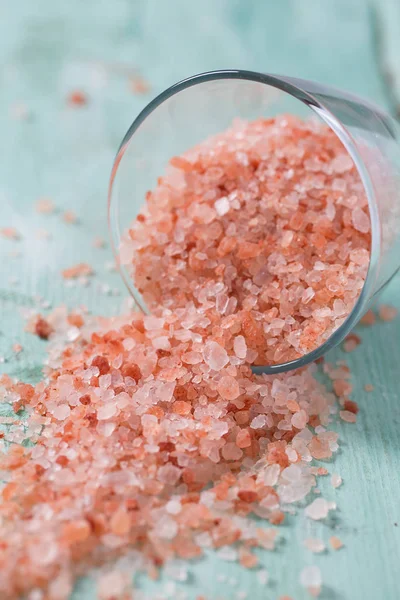 Himalayan Salt on turquoise wooden surface